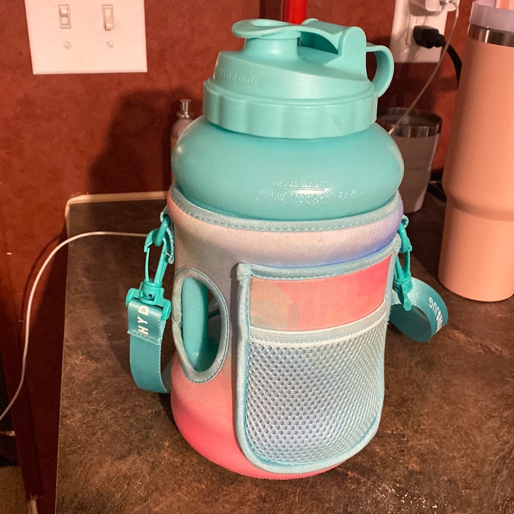Hydro jug with sleeve and strap
